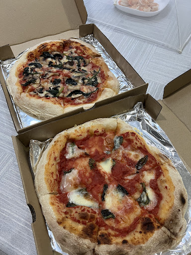 Two TomatoPapi pizzas — Funghi e Spinaci and Margherita in delivery boxes
